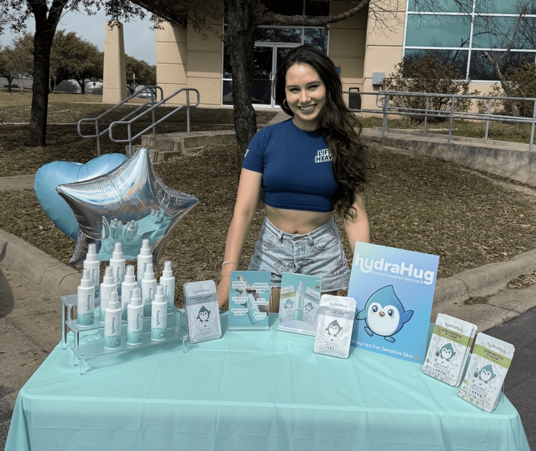 HydraHug Founder Iris with HydraHug Skincare Products