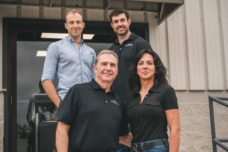 The founders of The Luxury Pergola outside their office
