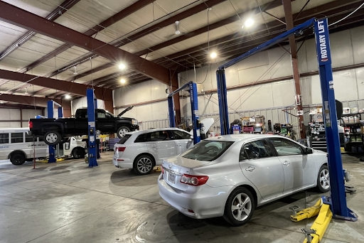 Auto repair in Bennington, NE by Accelerated Diagnostic and Automotive. Image of a full-service auto repair shop with multiple vehicles on lifts, showcasing advanced diagnostics, efficient workflow, and professional maintenance for all makes and models.