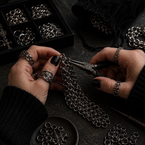 Close-up craftsmanship detail of chainmail-inspired gothic accessories.