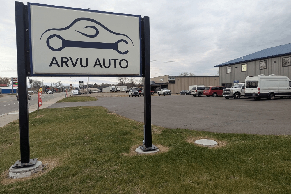  Car care, auto repair in Cokato, MN, at Arvu Auto. Roadside sign for Arvu Auto in Cokato, MN, directing drivers to a trusted local auto repair shop offering summer vehicle maintenance, diagnostics, preventative maintenance, and complete automotive repair services.